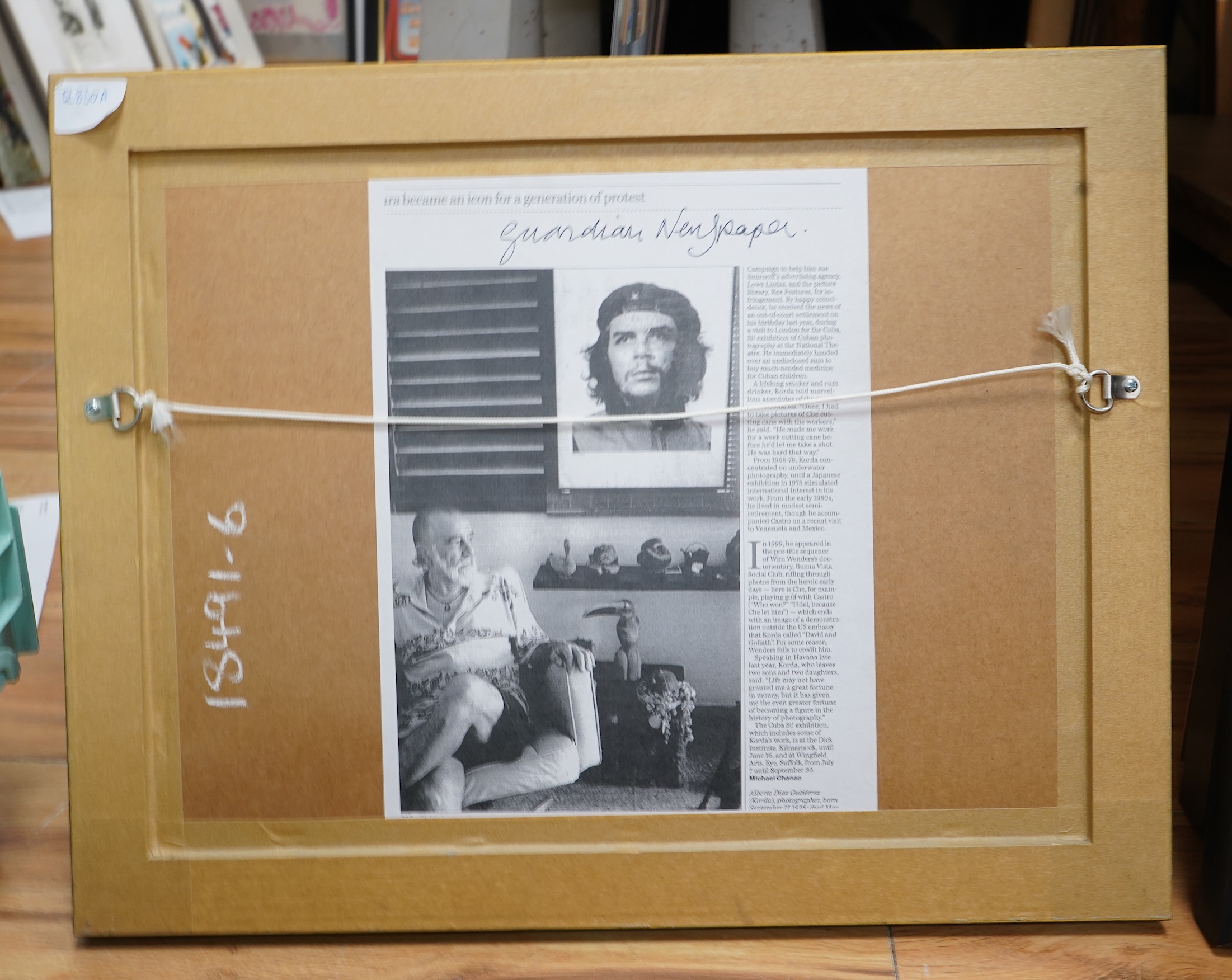 After Alberto Korda (1928-2001), ‘Che Guevara fishing’, stamped, facsimile signature, gelatin silver print, 20 x 26cm